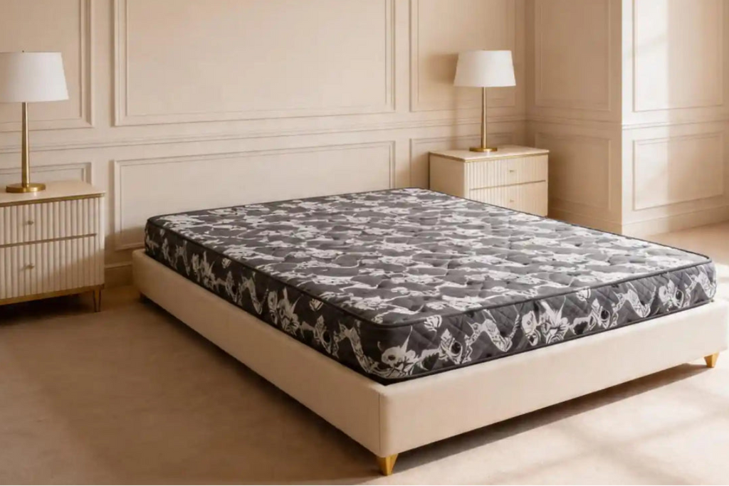 Mattress on a bed in a bedroom with two lamps and nightstands.