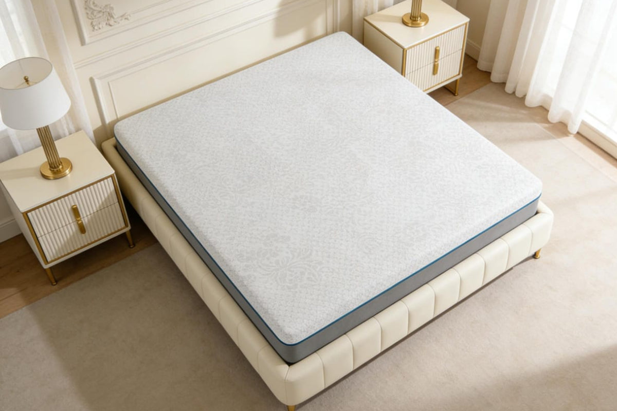 Mattress on a bed in a bedroom setting with nightstands and lamps.